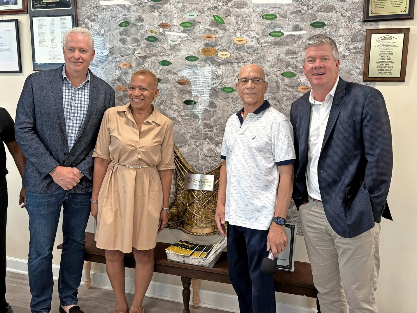 Steven Krieger, CEO B2K Development, Tracey Edwards SVP Sands New York, David Greaves, Presdient of John J. Byrnes Community Center, Ron Reese SVP Las Vegas Sands pictured with commemorating plaque